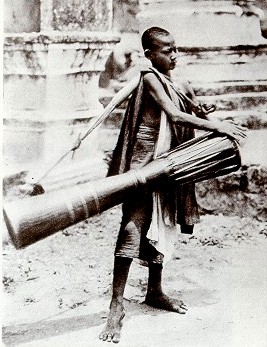 Novice beating a tailed drum (M.L.P. 1919)